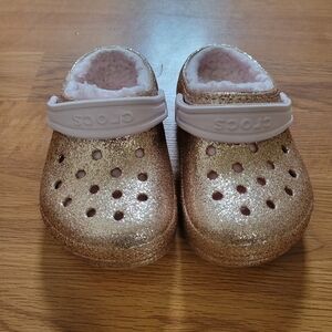 Crocs size 8c gold glitter with light pink. Only worn a hand full of times.  The